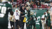 South Florida Bulls head coach Alex Golesh celebrates quarterback Byrum Brown (17) touchdown against Florida A&M Rattlers during the third quarter at Raymond James Stadium.