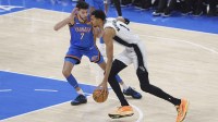 San Antonio Spurs forward/center Victor Wembanyama (1) drives to the basket past Oklahoma City Thunder center/forward Chet Holmgren (7) during the first quarter at Paycom Center.
