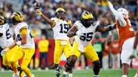 Michigan Wolverines quarterback Bryce Underwood (19) throws the ball against the Texas Longhorns during the second half at Camping World Stadium.