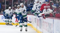 Vancouver Canucks center Max Sasson (63) celebrates with his teammates at the bench his goal against the Montreal Canadiens during the second period at Bell Centre.