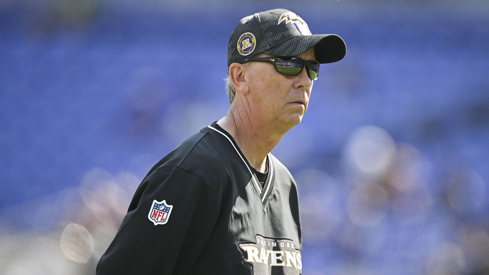 Baltimore Ravens offensive coordinator Todd Monken on the field before the game against the Washington Commanders at M&T Bank Stadium.