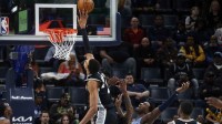 San Antonio Spurs forward Victor Wembanyama (1) blocks a shot attempt by Memphis Grizzlies forward/center Jaren Jackson Jr. (8) during the second quarter at FedExForum.