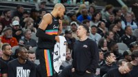 San Antonio Spurs forward/center Victor Wembanyama (1) talks with San Antonio Spurs Head Coach Mitch Johnson in the first half against the Milwaukee Bucks at Frost Bank Center.