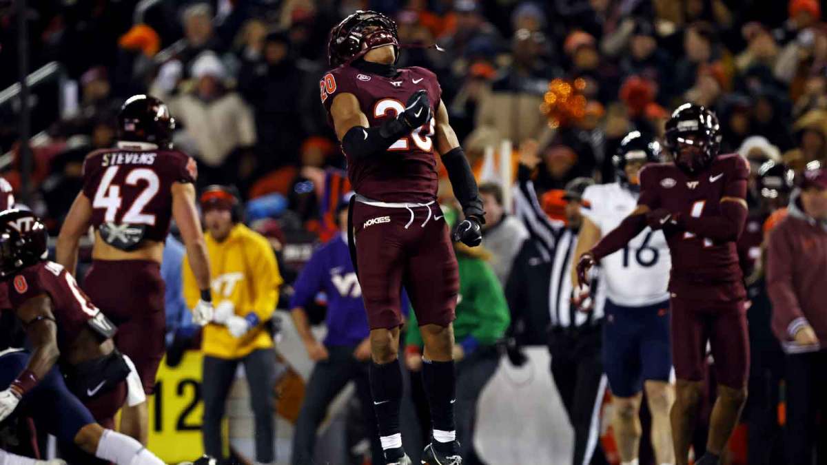 Virginia Tech Hokies linebacker Caleb Woodson (20) celebrates after a play during the second quarter against the Virginia Cavaliers at Lane Stadium.