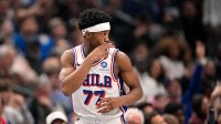 Philadelphia 76ers guard Vj Edgecombe (77) celebrates making a three point basket against the Dallas Mavericks during the second quarter at the American Airlines Center.