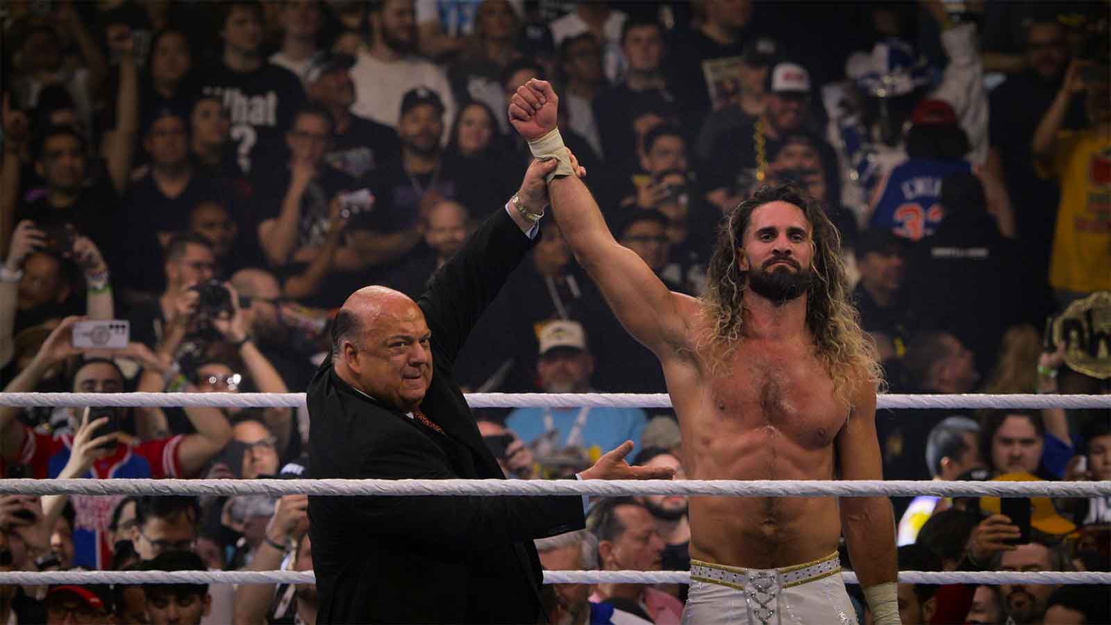 Paul Heyman and Seth Rollins.