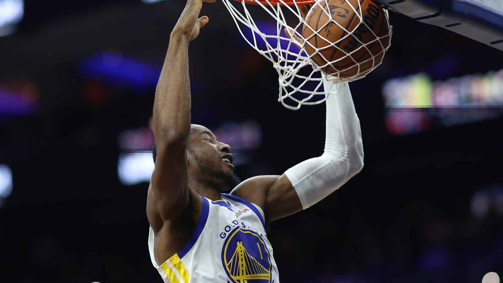 Warriors forward Jonathan Kuminga (1) dunks the ball against the Philadelphia 76ers during the third quarter at Xfinity Mobile Arena