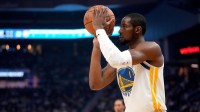 Warriors forward Jonathan Kuminga (1) shoots the ball against the Oklahoma City Thunder in the first quarter at the Chase Center with ESPN's Brian Windhorst in the background