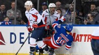 Washington Capitals left wing Alex Ovechkin (8) checks New York Rangers left wing Artemi Panarin (10) during the third period in game two of the first round of the 2024 Stanley Cup Playoffs at Madison Square Garden.