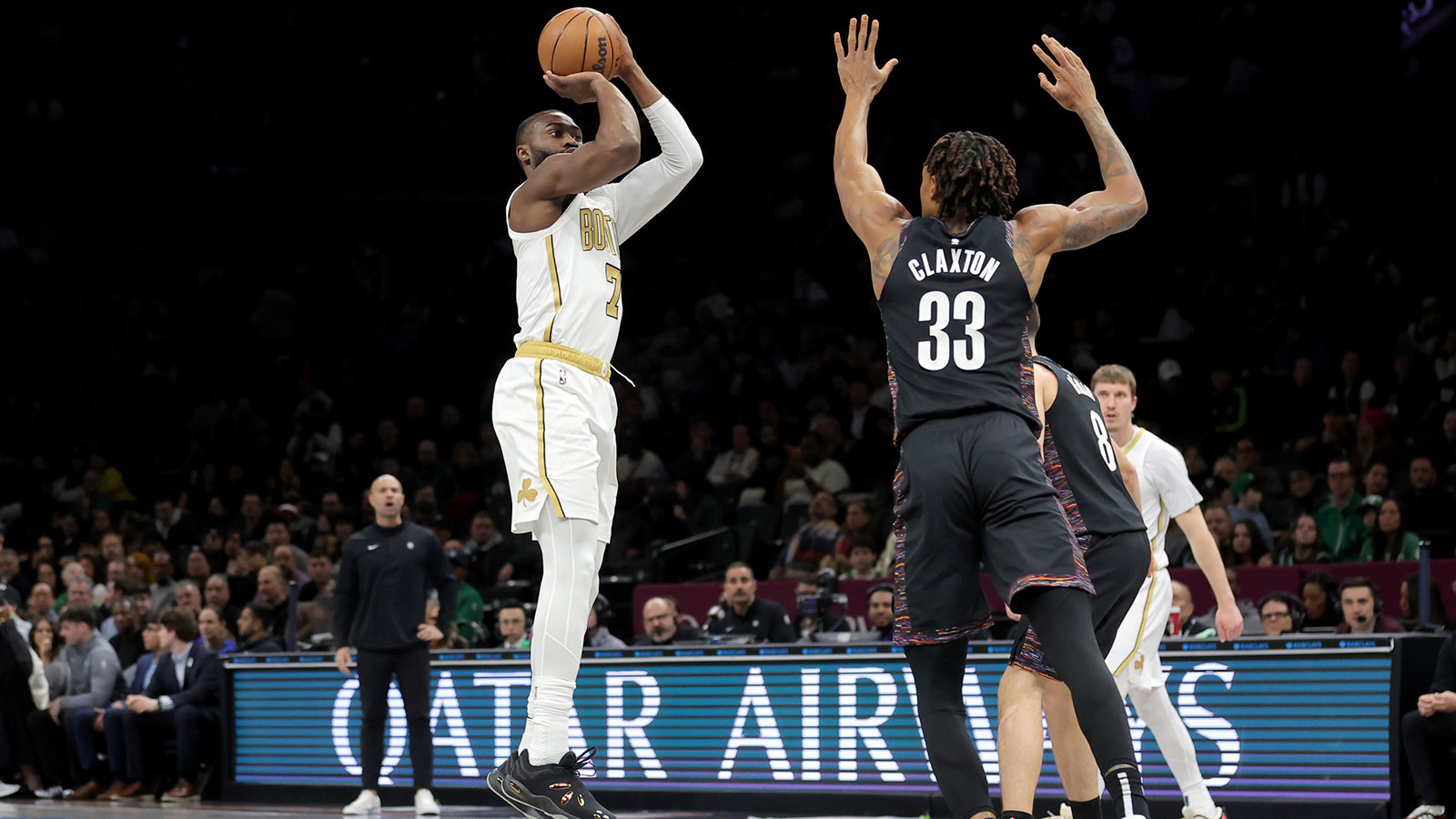 Boston Celtics guard Jaylen Brown (7) takes a shot against Brooklyn Nets center Nic Claxton (33) and guard Egor Demin (8) during the first quarter at Barclays Center.