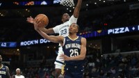 New Orleans Pelicans forward Trey Murphy III (25) shoots as Memphis Grizzlies forward Cedric Coward (23) defends during the second quarter at FedExForum.