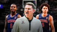 Arizona HC Tommy Lloyd (front, center) with Arizona PG Jaden Bradley and Arizona SG Brayden Burries. March madness logo in background