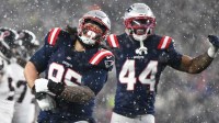 New England Patriots defensive lineman Khyiris Tonga (95) celebrates a sack in the fourth quarter against the New England Patriots in an AFC Divisional Round game at Gillette Stadium.
