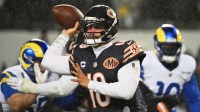 Chicago Bears quarterback Caleb Williams (18) throws a pass against the Los Angeles Rams during the third quarter of an NFC Divisional Round game at Soldier Field