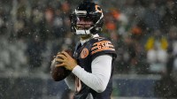 Chicago Bears quarterback Caleb Williams (18) warms up prior to an NFC Wild Card Round game against the Green Bay Packers at Soldier Field.