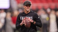 Atlanta Falcons offensive coordinator Zac Robinson on the field before a game against the Los Angeles Rams at Mercedes-Benz Stadium.