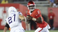 Aug 28, 2025; Houston, Texas, USA; Houston Cougars quarterback Zeon Chriss (2) rolls out of the pocket with the ball during the fourth quarter against the Stephen F. Austin Lumberjacks at TDECU Stadium. Mandatory.