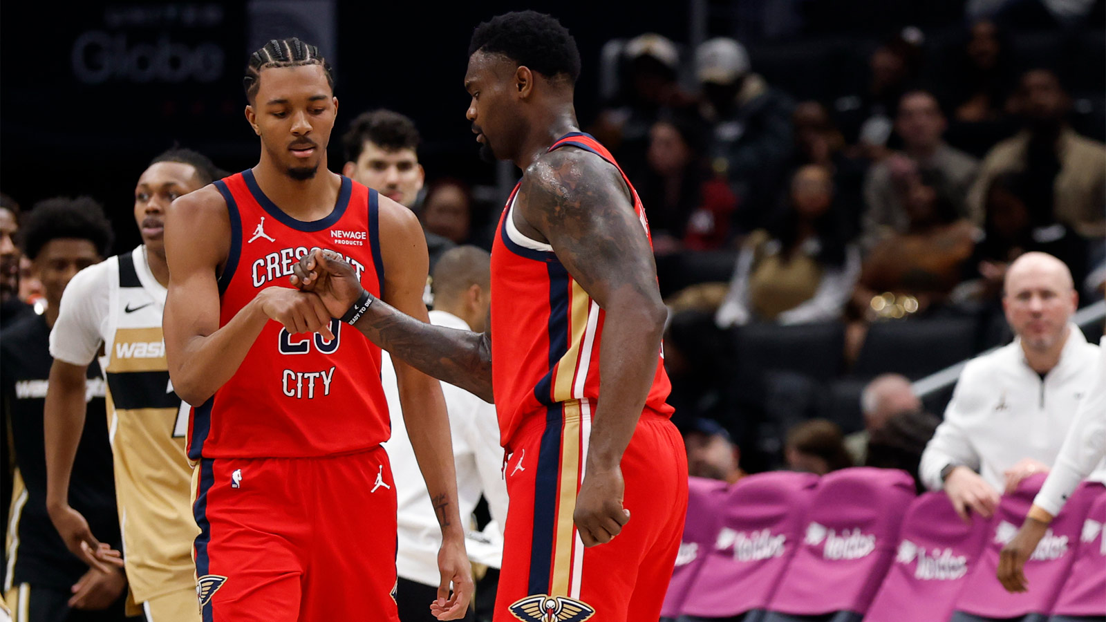 New Orleans Pelicans forward Trey Murphy III (25) celebrates with Pelicans forward Zion Williamson (1) against the Washington Wizards in the second half at Capital One Arena.