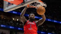 New Orleans Pelicans forward Zion Williamson (1) dunks the ball against Portland Trail Blazers forward Deni Avdija (8) during the second half at Smoothie King Center.