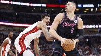 Jan 29, 2026; Chicago, Illinois, USA; Chicago Bulls center Nikola Vucevic (9) looks to shoot against Miami Heat center Kel'el Ware (7) during the first half at United Center. Mandatory Credit: Kamil Krzaczynski-Imagn Images
