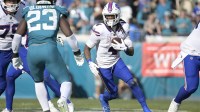 Buffalo Bills running back James Cook III (4) carries the ball during the second half against the Jacksonville Jaguars in an AFC Wild Card Round game at EverBank Stadium.