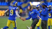 Los Angeles Rams head coach Sean McVay reacts with quarterback Matthew Stafford (9) after a touchdown against the Arizona Cardinals during the second half at SoFi Stadium.