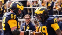 Michigan quarterback Bryce Underwood (19) celebrates a touchdown against Central Michigan with offensive lineman Andrew Sprague (54) during the second half at Michigan Stadium in Ann Arbor on Saturday, Sept. 13, 2025.