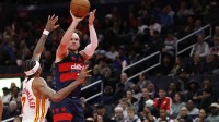 Washington Wizards forward Corey Kispert (24) shoots the ball as Atlanta Hawks guard Nickeil Alexander-Walker (7) defends in the second half at Capital One Arena.
