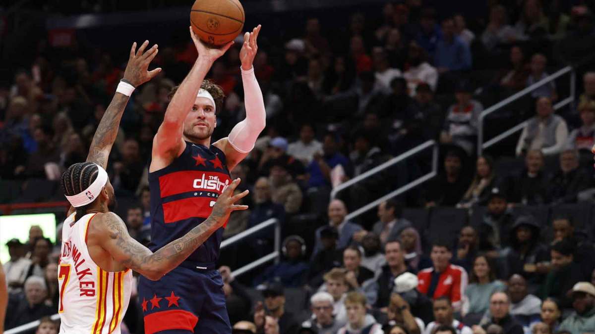 Washington Wizards forward Corey Kispert (24) shoots the ball as Atlanta Hawks guard Nickeil Alexander-Walker (7) defends in the second half at Capital One Arena.