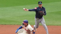 Seattle Mariners second base Cole Young (2) throws for a double play after tagging out Philadelphia Phillies second base Bryson Stott (5) during the fourth inning at Citizens Bank Park.