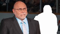 Barry Trotz next to silhouette of Michael Bunting