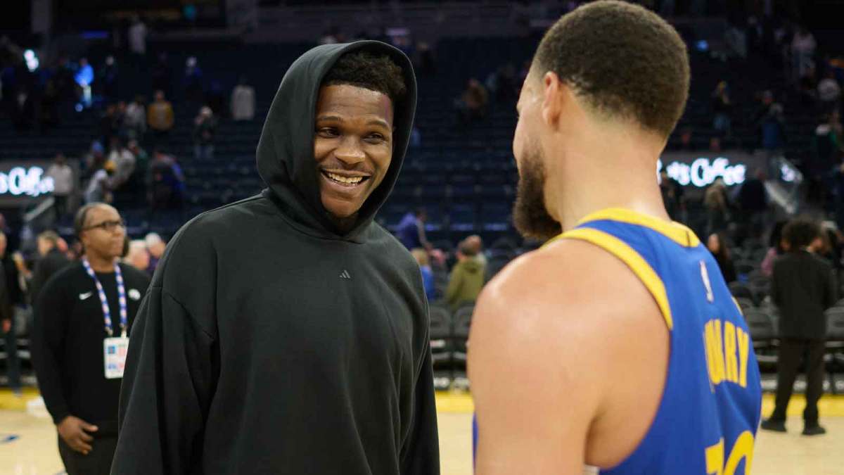 Minnesota Timberwolves guard Anthony Edwards (5) chats with Golden State Warriors guard Stephen Curry (30) at center court after the game at Chase Center. Mandatory Credit: Robert Edwards-Imagn Images