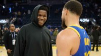 Minnesota Timberwolves guard Anthony Edwards (5) chats with Golden State Warriors guard Stephen Curry (30) at center court after the game at Chase Center. Mandatory Credit: Robert Edwards-Imagn Images