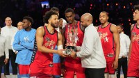Team USA Stars guard Cade Cunningham (2) of the Detroit Pistons and head coach J. B. Bickerstaff lift the trophy during the 75th NBA All Star Game at Intuit Dome.