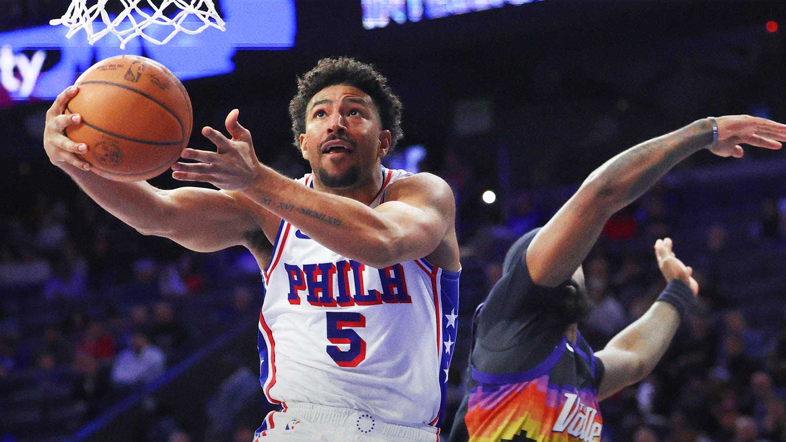 76ers guard Quentin Grimes (5) drives for a shot past Phoenix Suns forward Royce O'Neale (00) during the third quarter at Xfinity Mobile Arena