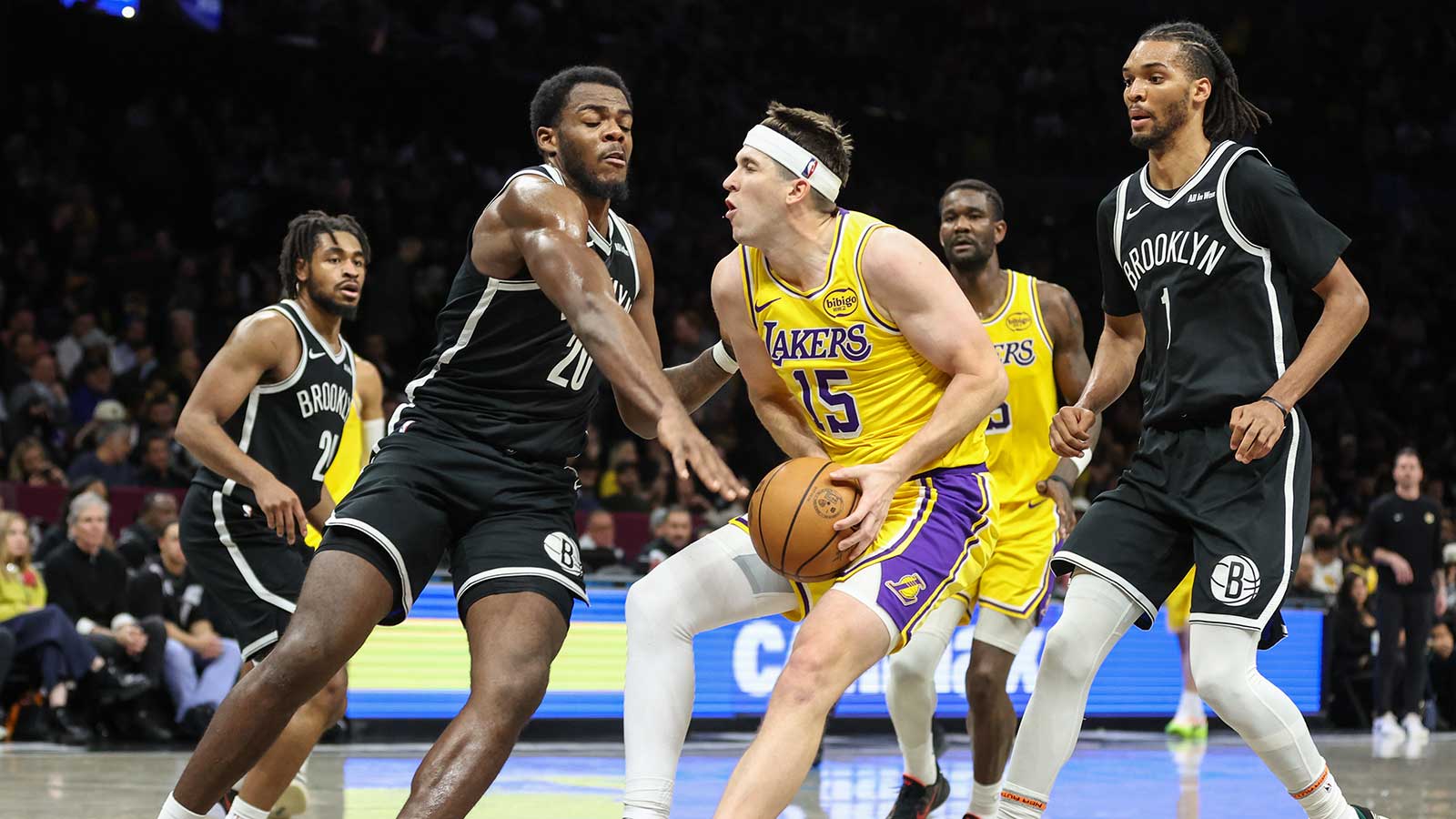 Los Angeles Lakers guard Austin Reaves (15) looks to drive past Brooklyn Nets center Day'ron Sharpe (20) in the fourth quarter at Barclays Center.