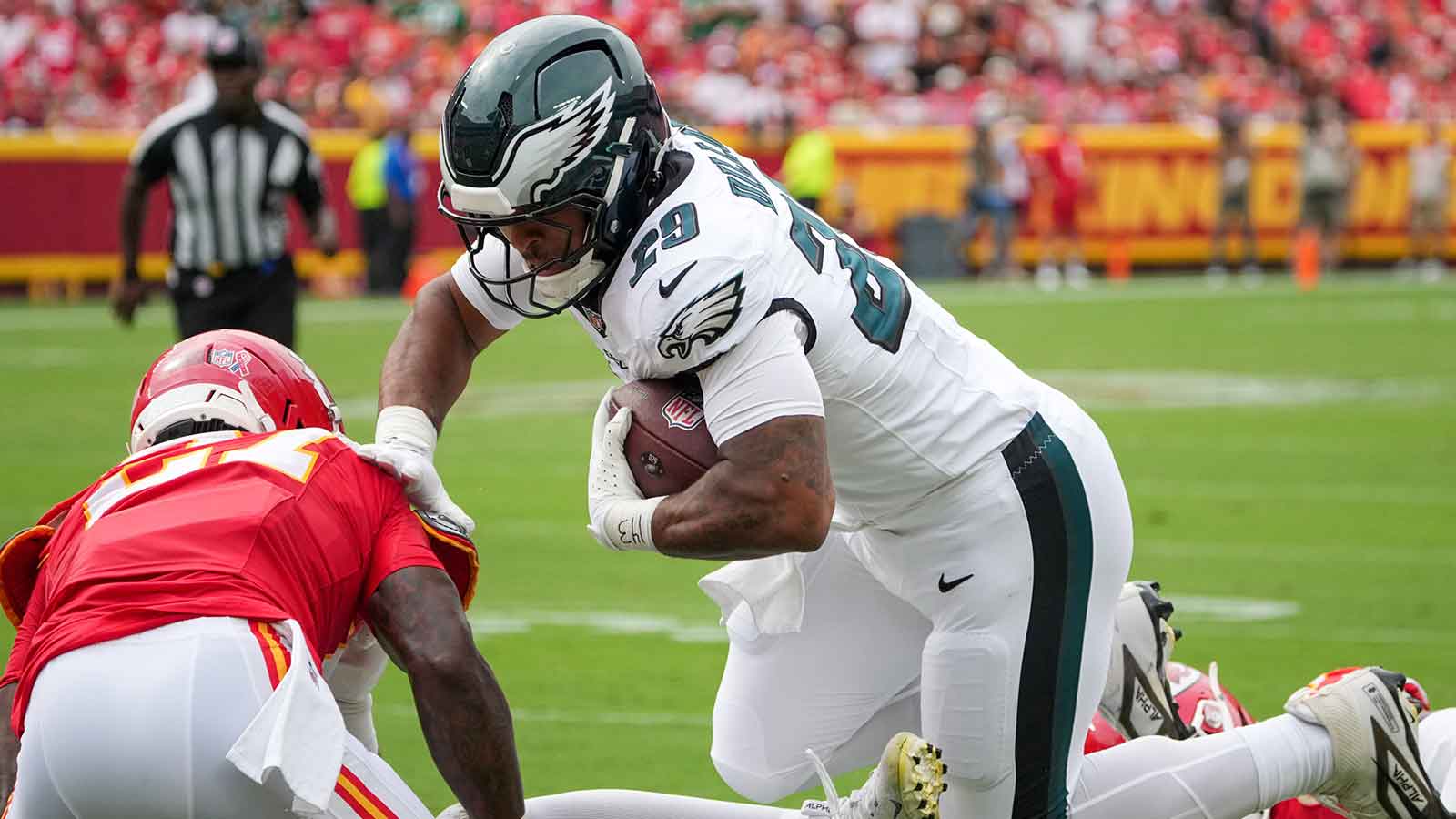 Philadelphia Eagles running back AJ Dillon (29) runs the ball against the Kansas City Chiefs during the game at GEHA Field at Arrowhead Stadium.