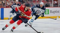 Florida Panthers left wing A.J. Greer (10) moves the puck against the Winnipeg Jets during the first period at Amerant Bank Arena.