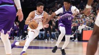 Phoenix Suns guard Devin Booker (1) drives against Utah Jazz guard Ace Bailey (19) during the first quarter at Delta Center. Mandatory Credit: Rob Gray-Imagn Images