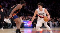 Portland Trail Blazers forward Deni Avdija (8) controls the ball against New York Knicks center Mitchell Robinson (23) during the fourth quarter at Madison Square Garden