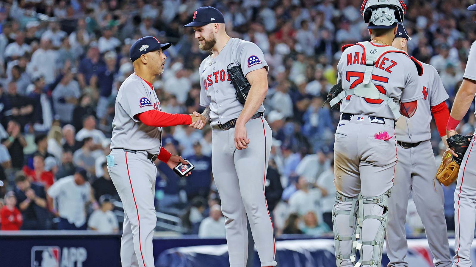Boston Red Sox manager Alex Cora (13) reacts after a play during the eighth inning against the New York Yankees during game one of the Wildcard round for the 2025 MLB playoffs at Yankee Stadium. 