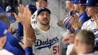 Los Angeles Dodgers relief pitcher Alex Vesia (51) celebrates with teamamtes after throwing against the Cincinnati Reds in the eighth inning during game two of the Wildcard round for the 2025 MLB playoffs at Dodger Stadium.