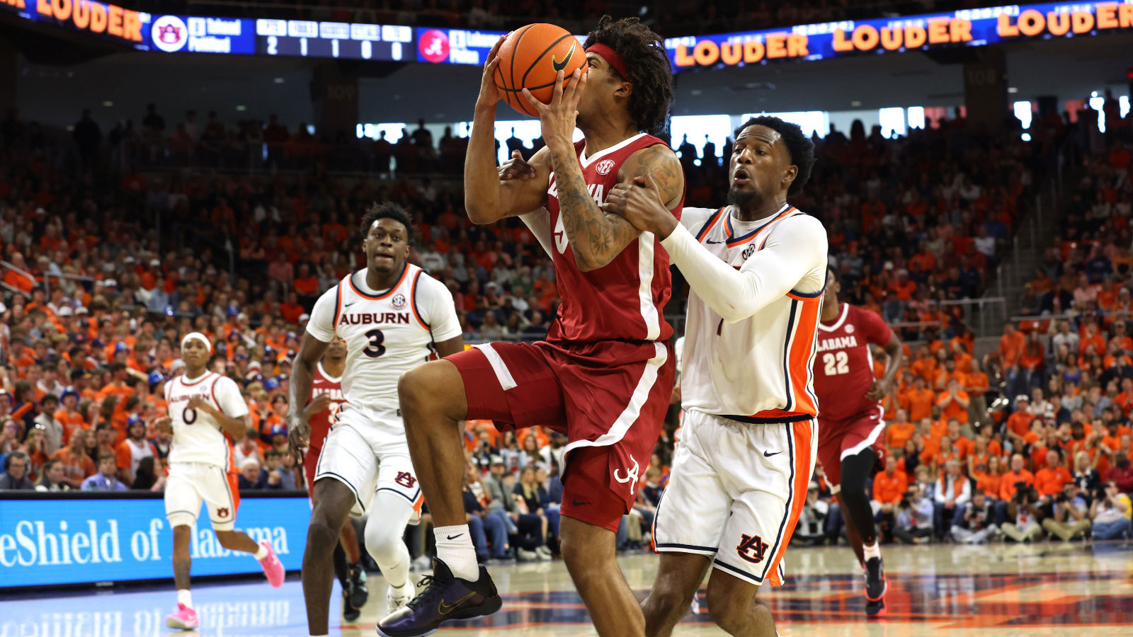 Auburn Tigers guard Kevin Overton (1) fouls Alabama Crimson Tide forward Amari Allen (5) during the first half at Neville Arena. 