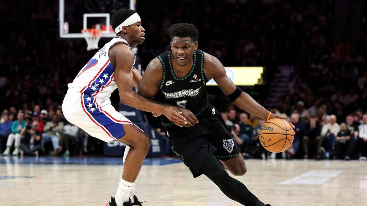 Minnesota Timberwolves guard Anthony Edwards (5) works around Philadelphia 76ers guard Vj Edgecombe (77) during the second half at Target Center.