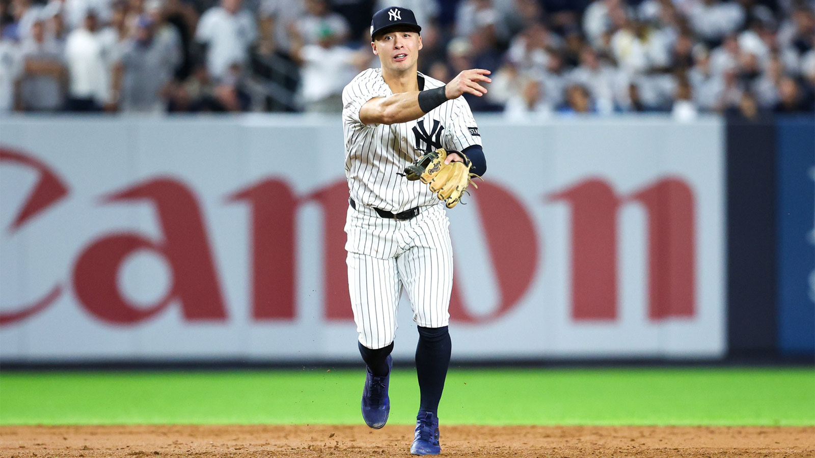New York Yankees shortstop Anthony Volpe (11) throws a runner out in the sixth inning against the Toronto Blue Jays during game three of the ALDS round for the 2025 MLB playoffs at Yankee Stadium.