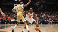 New York Knicks forward Og Anunoby (8) pushes off from Washington Wizards guard Bilal Coulibaly (0) during the third quarter at Capital One Arena