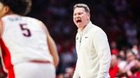 Arizona Wildcats head coach Tommy Lloyd yells out to players during the first half of the game against the Texas Tech Red Raiders at McKale Memorial Center.