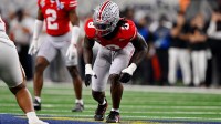 Ohio State Buckeyes linebacker Arvell Reese (8) gets into position during the 2025 Cotton Bowl and quarterfinal game of the College Football Playoff at AT&T Stadium.
