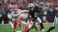 Las Vegas Raiders running back Ashton Jeanty (2) carries the ball against Kansas City Chiefs linebacker Drue Tranquill (23) in the first half at Allegiant Stadium.