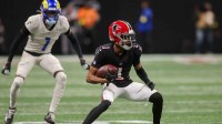Atlanta Falcons wide receiver Darnell Mooney (1) runs after a catch against the Los Angeles Rams in the third quarter at Mercedes-Benz Stadium.